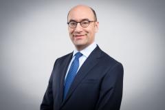 Steven A. Altman in business attire with a white background