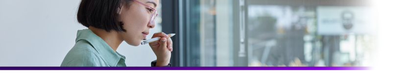 profile view of a female applicant holding a pen on her hand