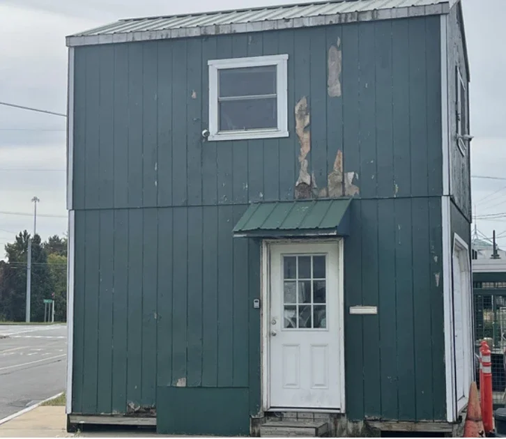 Green building with paint chipping