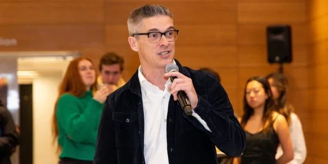 Clinical Professor Matt Statler speaks with students during the capstone’s fall semester final plenary