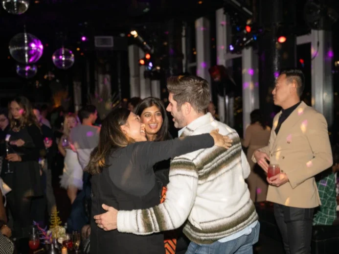 Alumni mingle at the Stern Identity Affinity 2023 Holiday Party at Le Bain in The Standard Hotel.