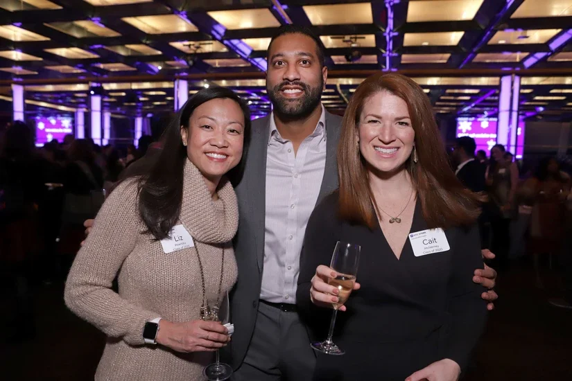 Liz (left) with two EMBA students, Tom Ozhuthual and Cait McNerney  