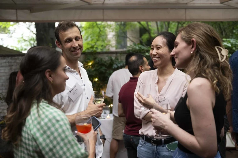 Alumni socialize at the Summer 2024 Tech Reception at Bottino restaurant in Chelsea, NY