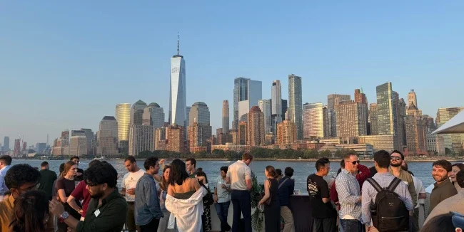 A group of MBA students look at the NYC skyline