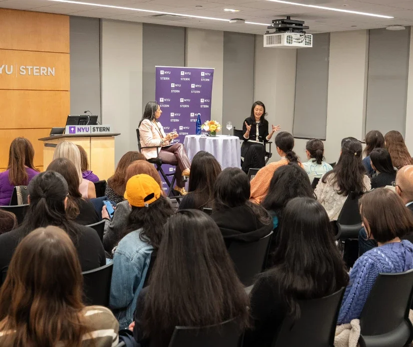 Tammy Henault (MBA '12) and Professor Dolly Chugh giving a fireside chat