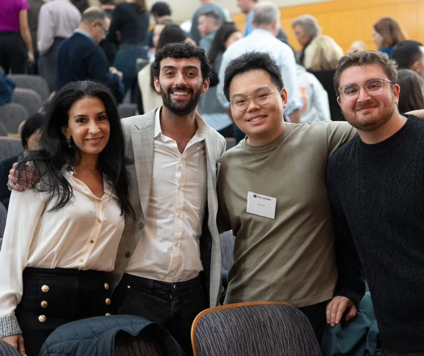 Alumni reconnecting during a networking reception