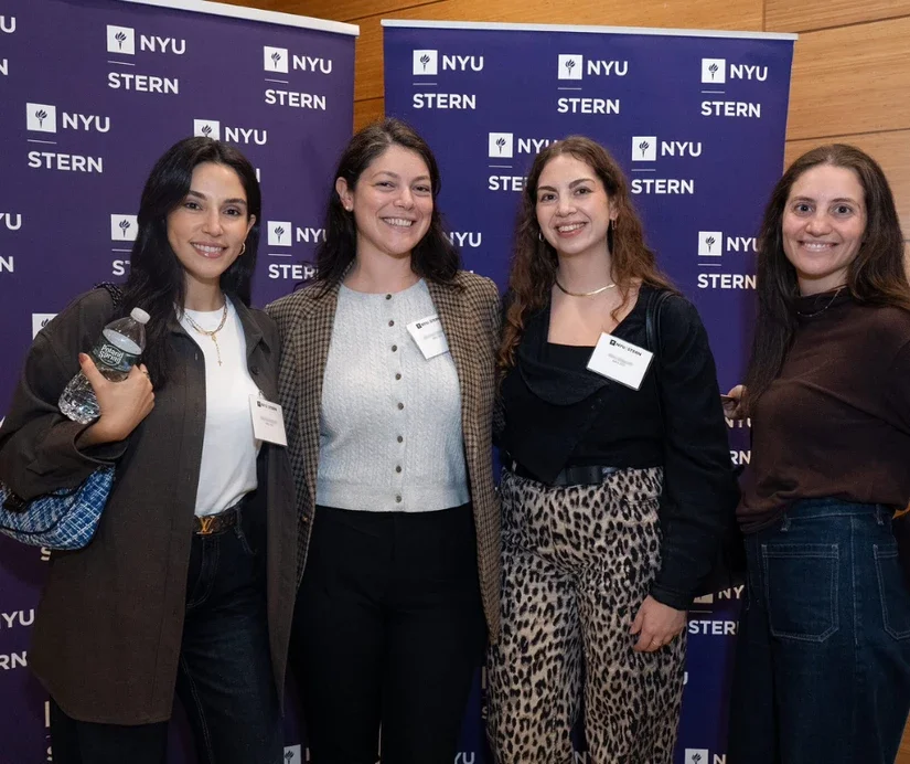 Alumni reconnecting during a networking reception