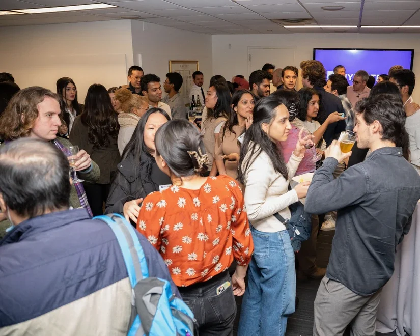 Alumni and students at a networking reception
