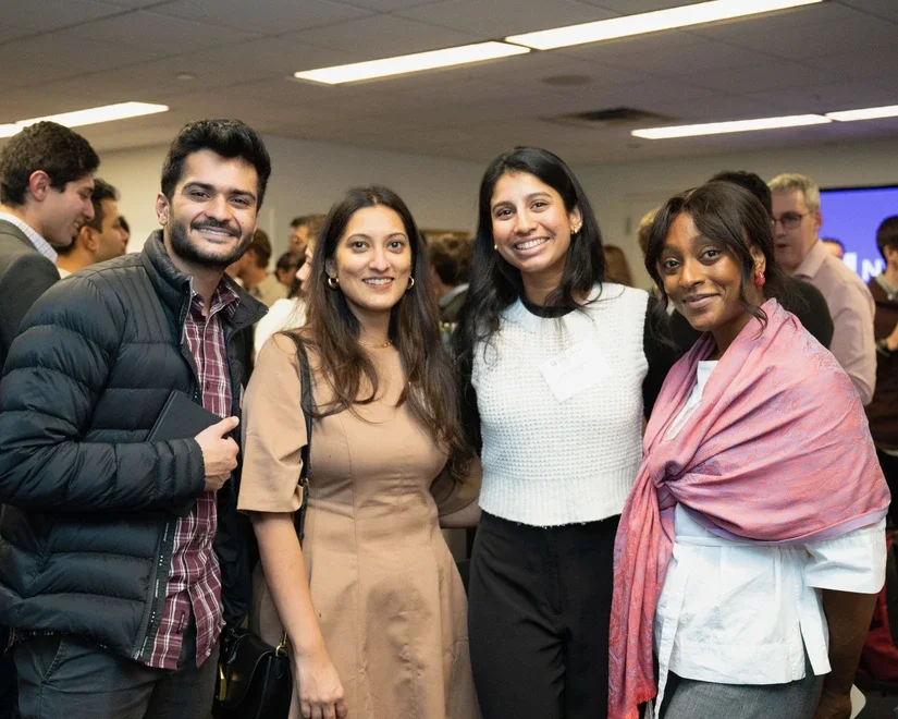 Alumni and students at a networking reception