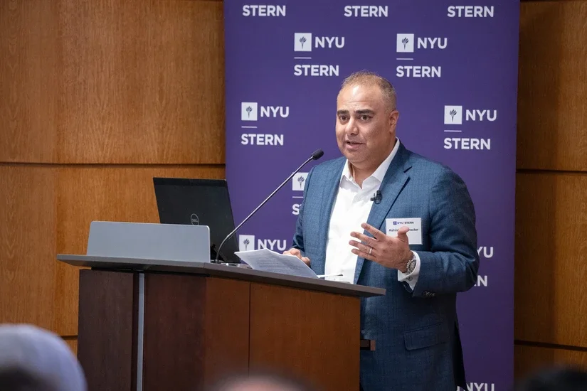 Ashish Contractor delivers opening remarks to attendees