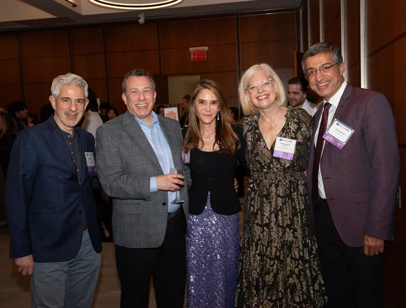From left: Executive Board member Alan Gallo (BS ’87, MBA ’90), Alumni Council member Barry Sands (MBA ‘99), Executive Board members Elizabeth Elting (MBA '92) and Susan Jurevics (MBA '96), along with Dean Bharat Anand at the Scholarship Reception