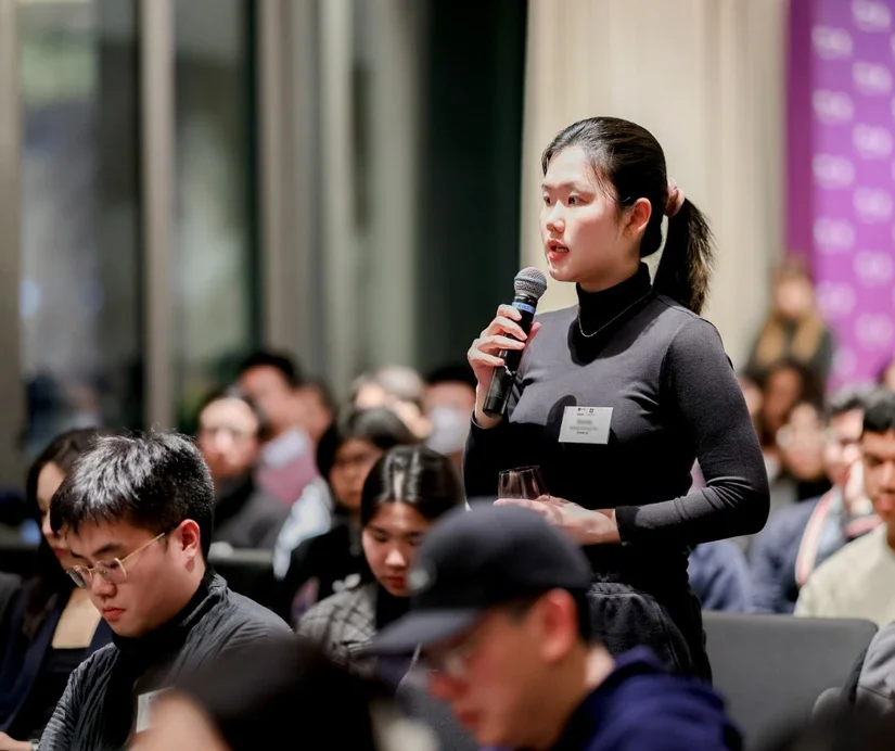 An audience member participating in the Q&A