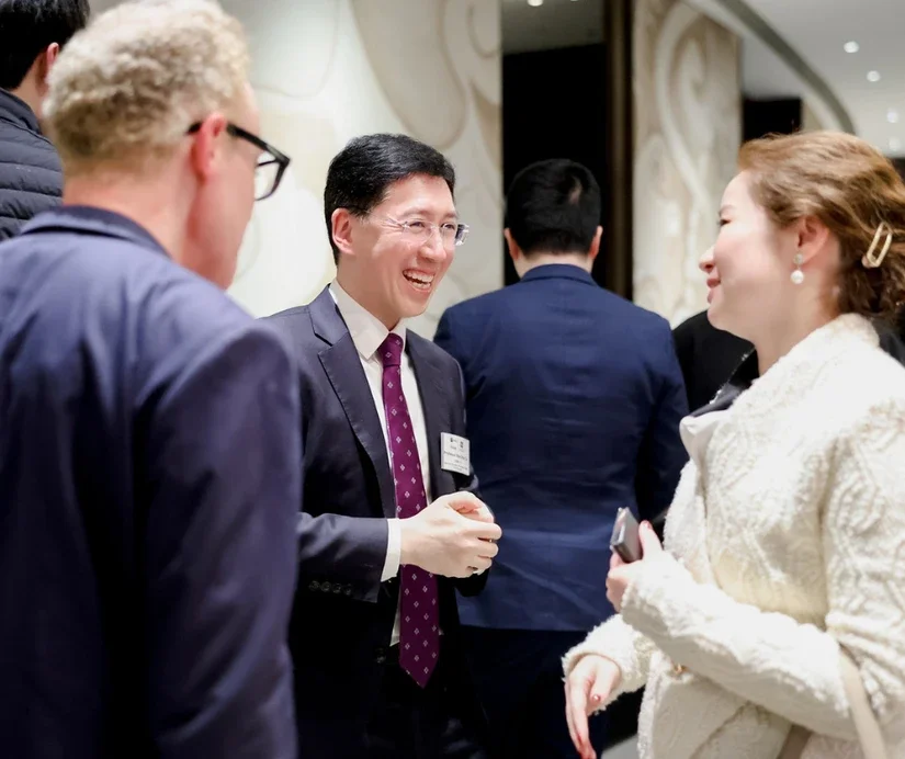 Both professors mingled with alumni during the reception