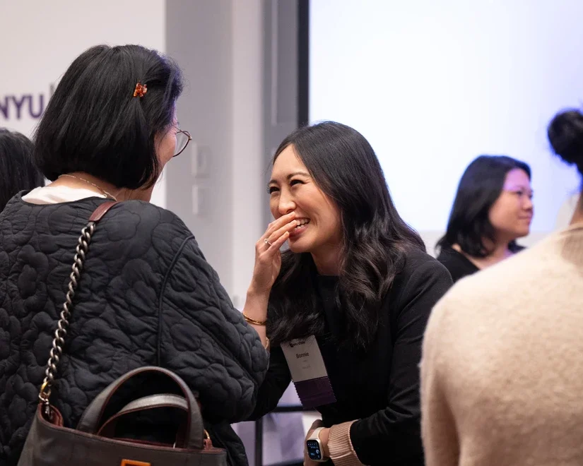 Panelists mingling with alumni