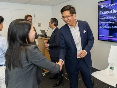 Executives networking with students