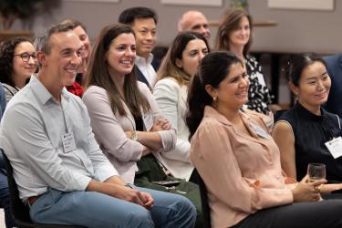 Image of audience members at an alumni event