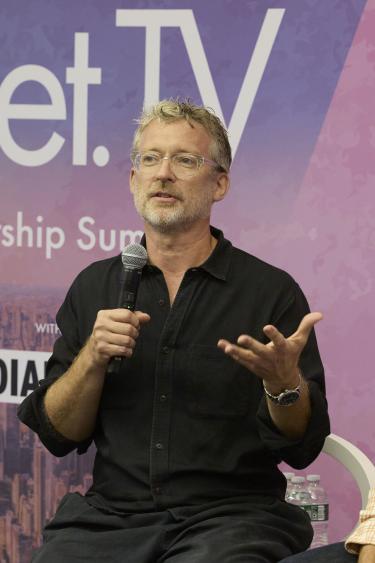 Justin Evans speaking at Advertising Week 2025 in New York City