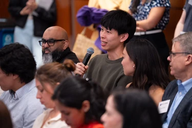 An alumnus asks a question during a Lifelong Learning event