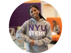 Student posing in a grey NYU Stern hoodie
